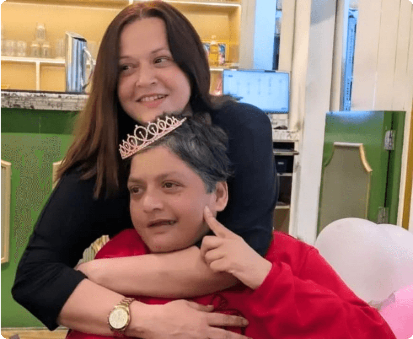 Sindhu embracing her sister Mukta at a celebration