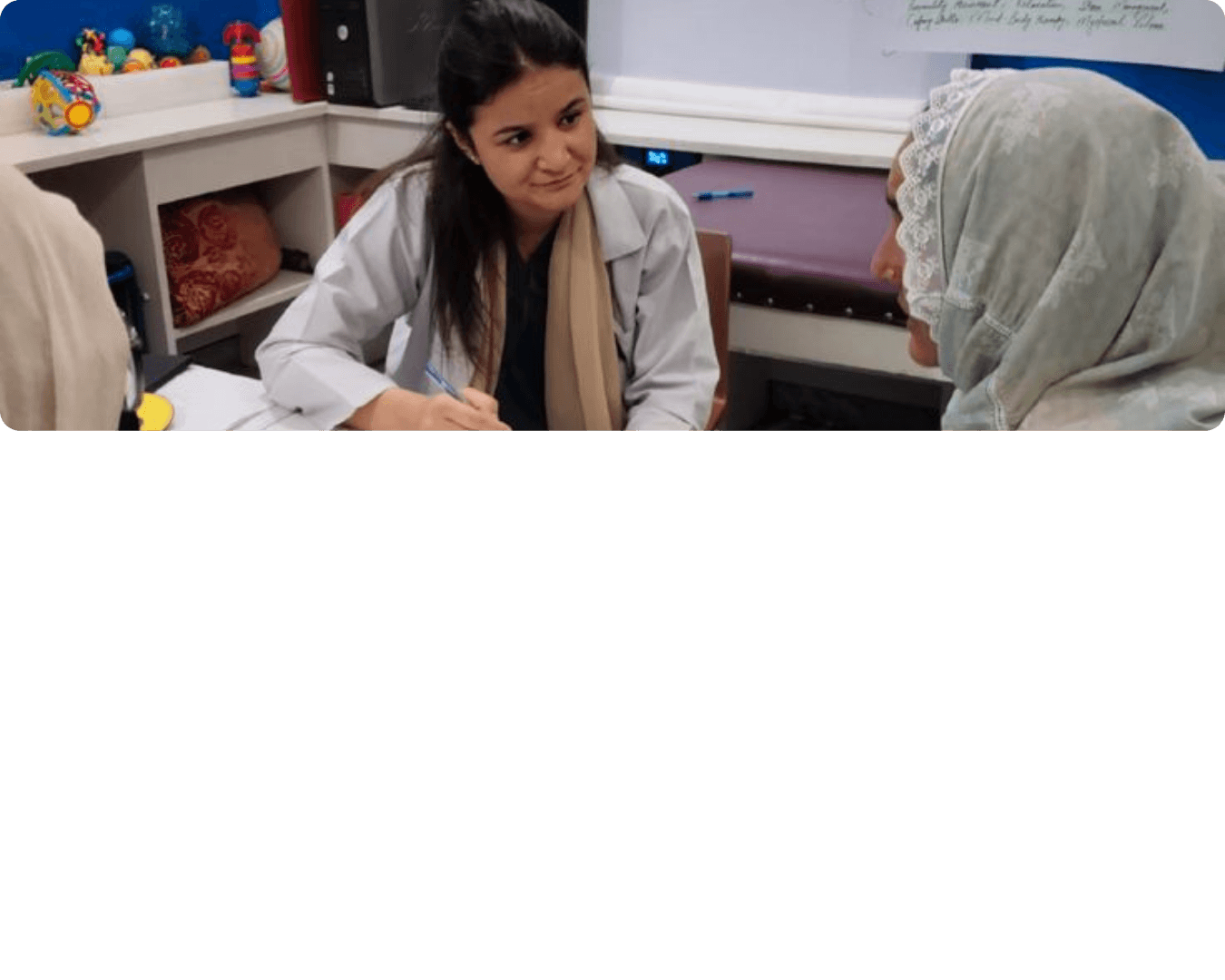 Therapist speaking with a client in a clinical setting