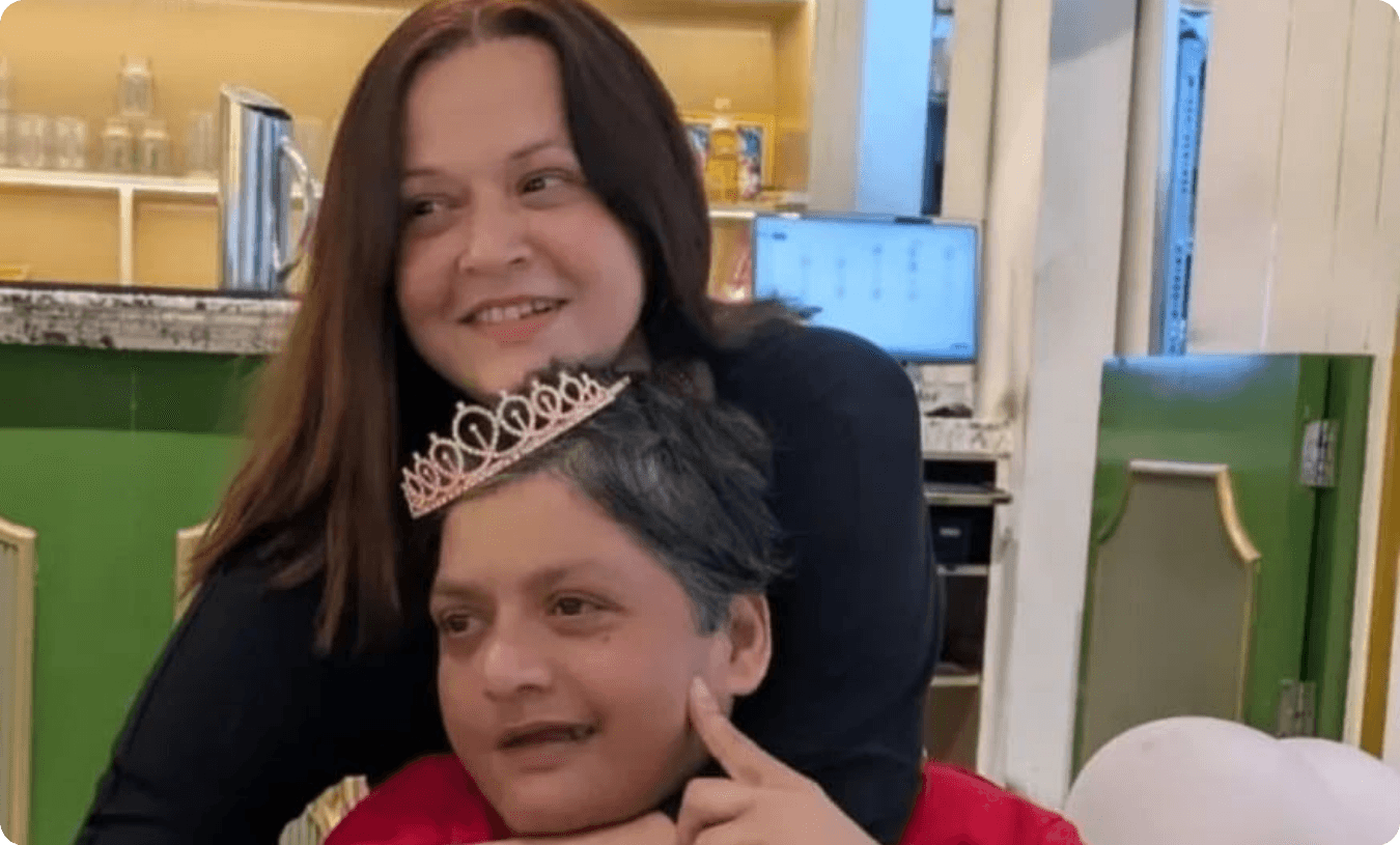Sindhu embracing her sister Mukta at a celebration