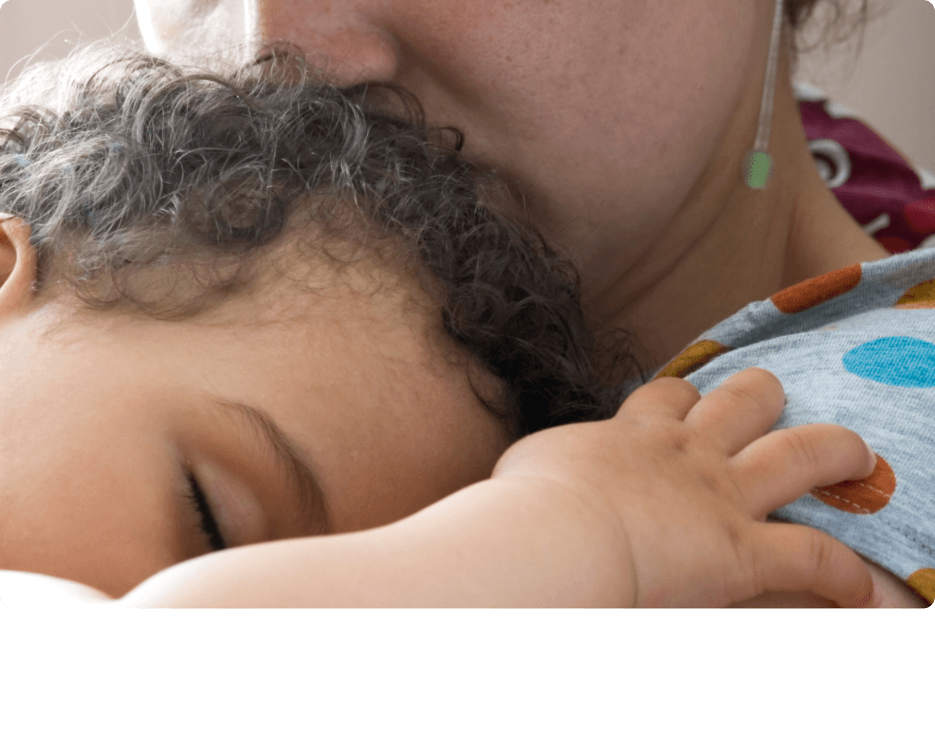 Person embracing a small child